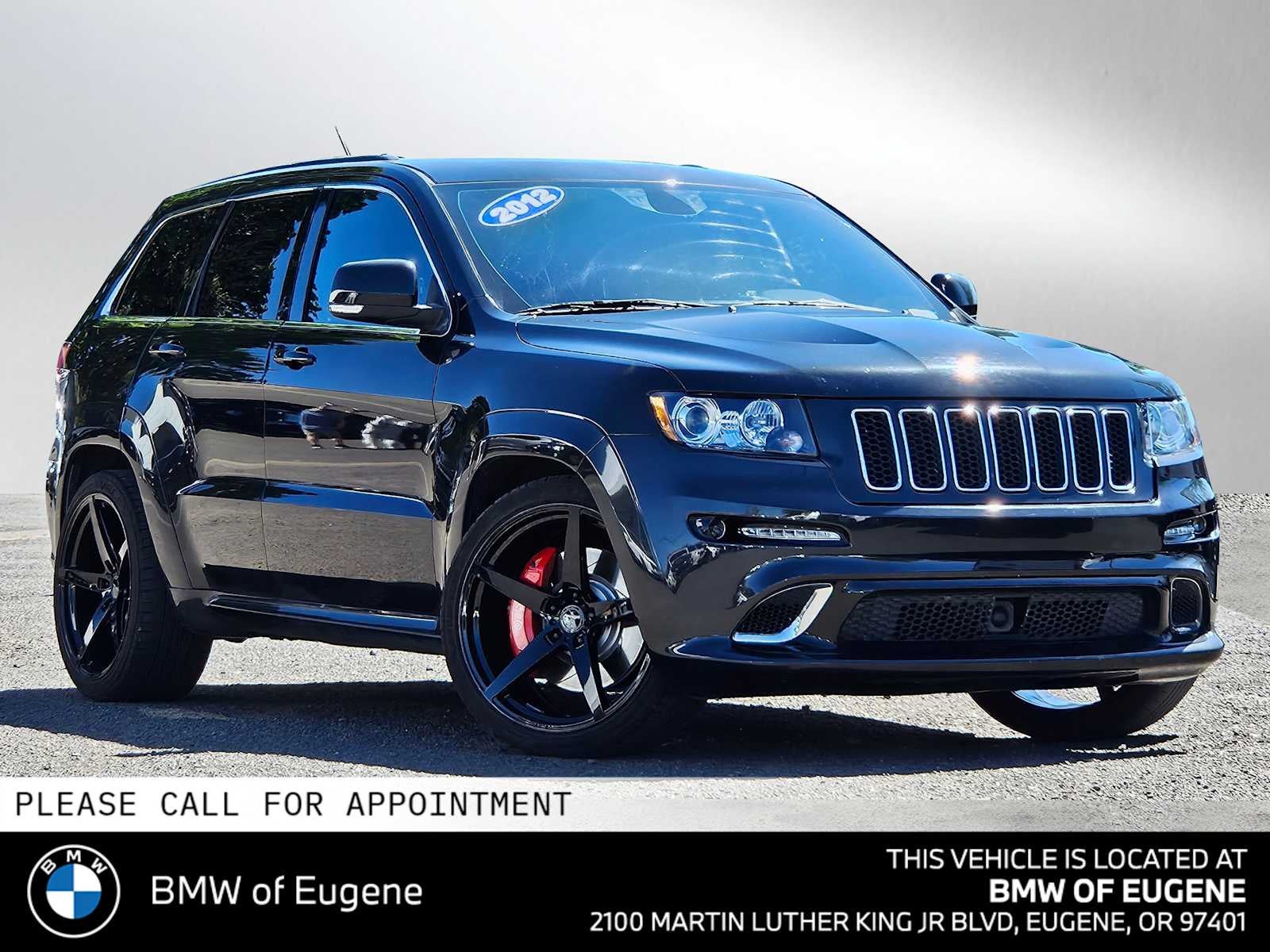 2012 Jeep Grand Cherokee SRT8 in Brilliant Black Crystal Pearl — front three-quarter view