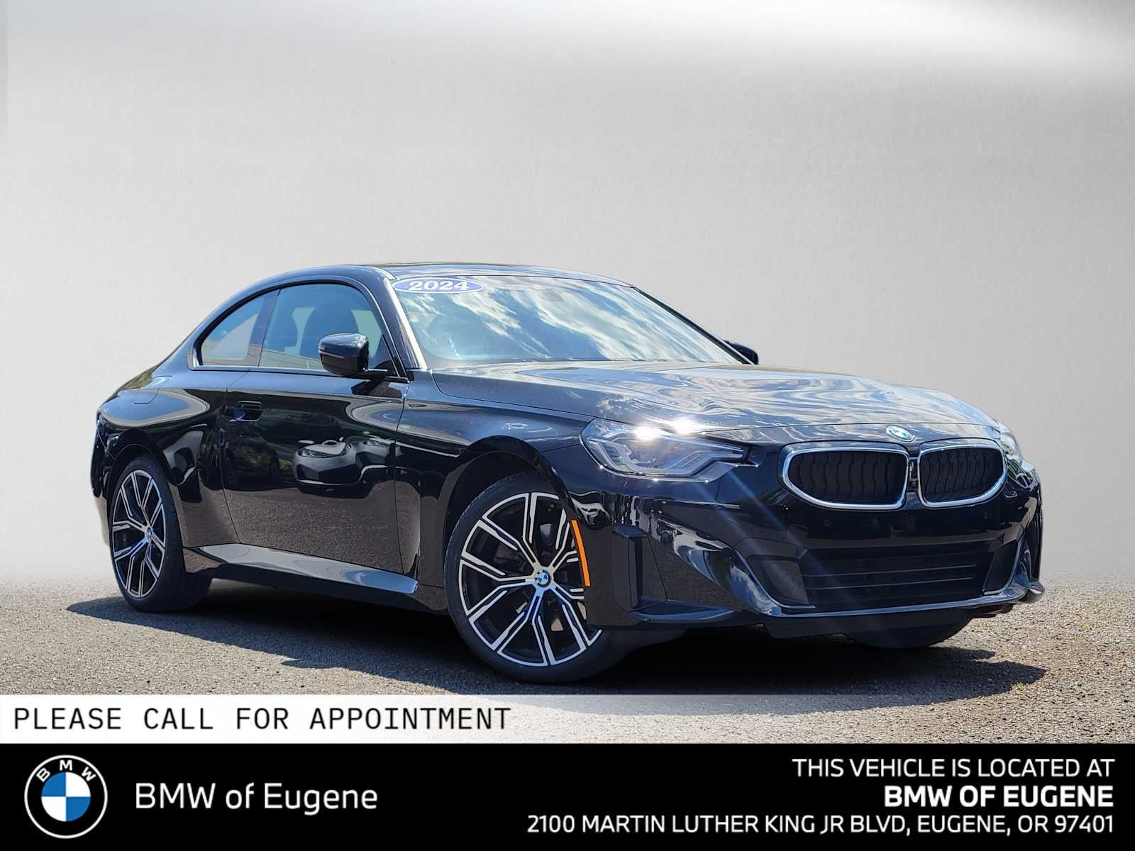 2024 BMW 230i xDrive 230i xDrive in Jet Black — front three-quarter view