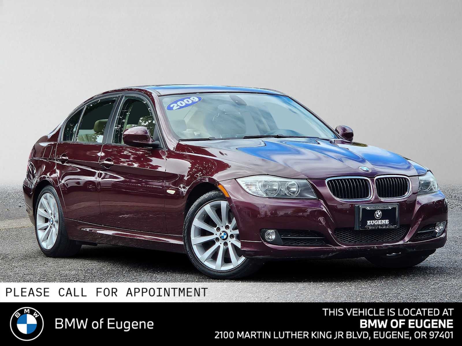 2009 BMW 3 Series 328i in Barbera Red Metallic — front three-quarter view