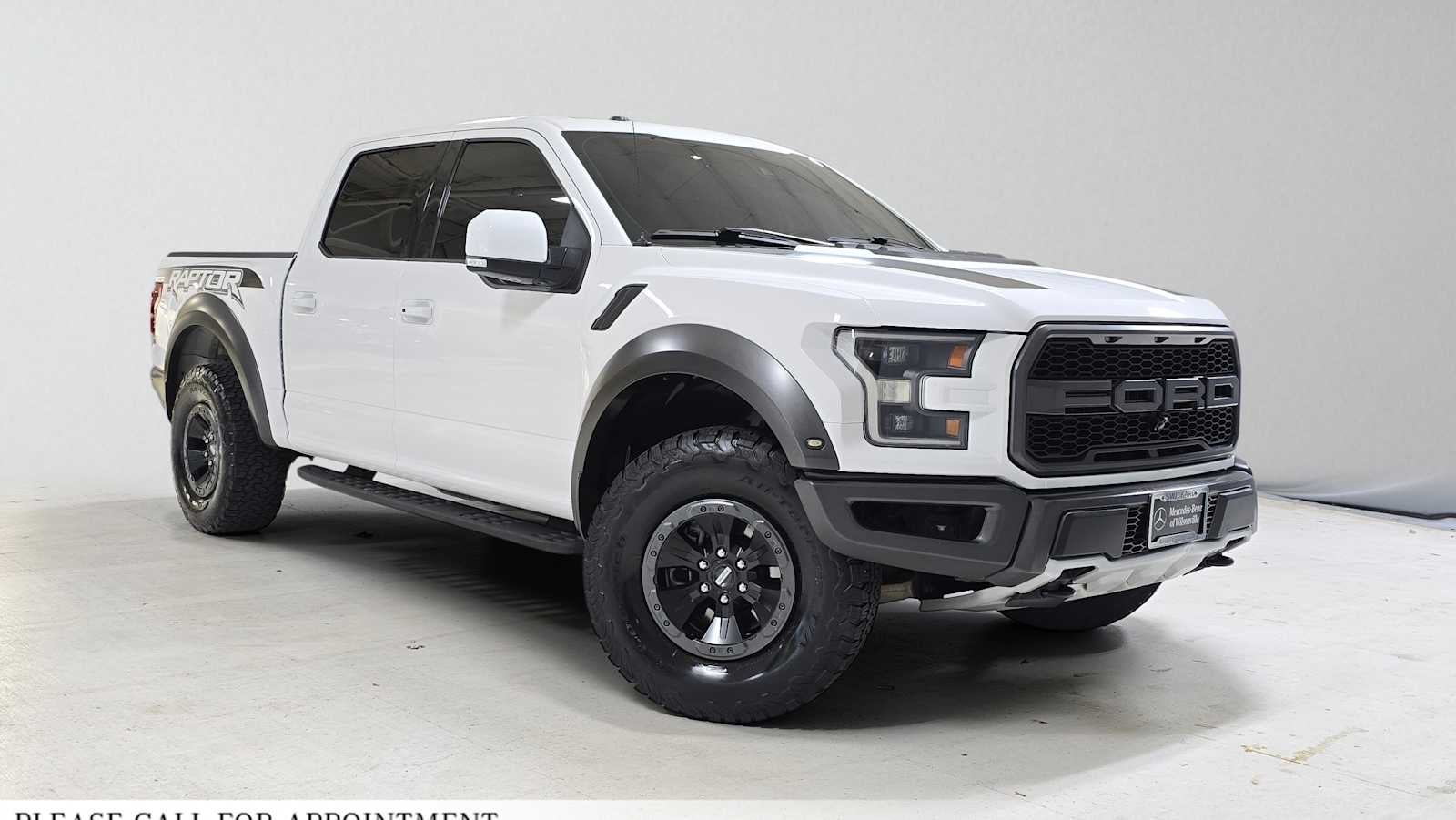 2018 Ford F-150 Raptor in Oxford White — front three-quarter view