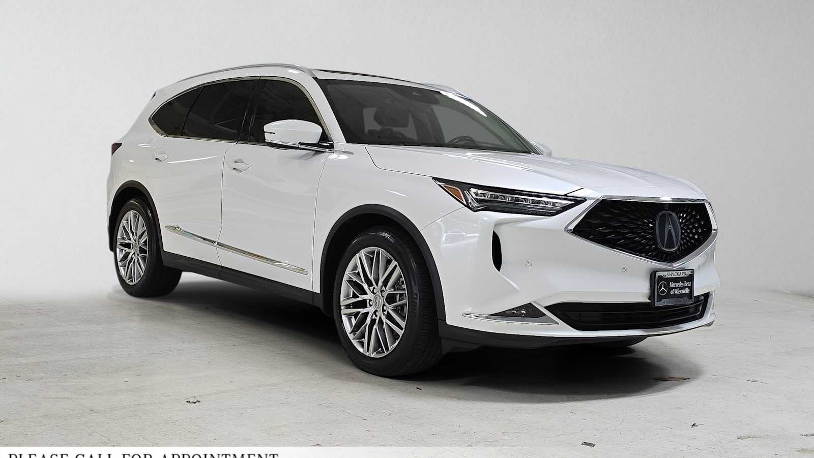 2023 Acura MDX w/Advance Package in Platinum White Pearl — front three-quarter view