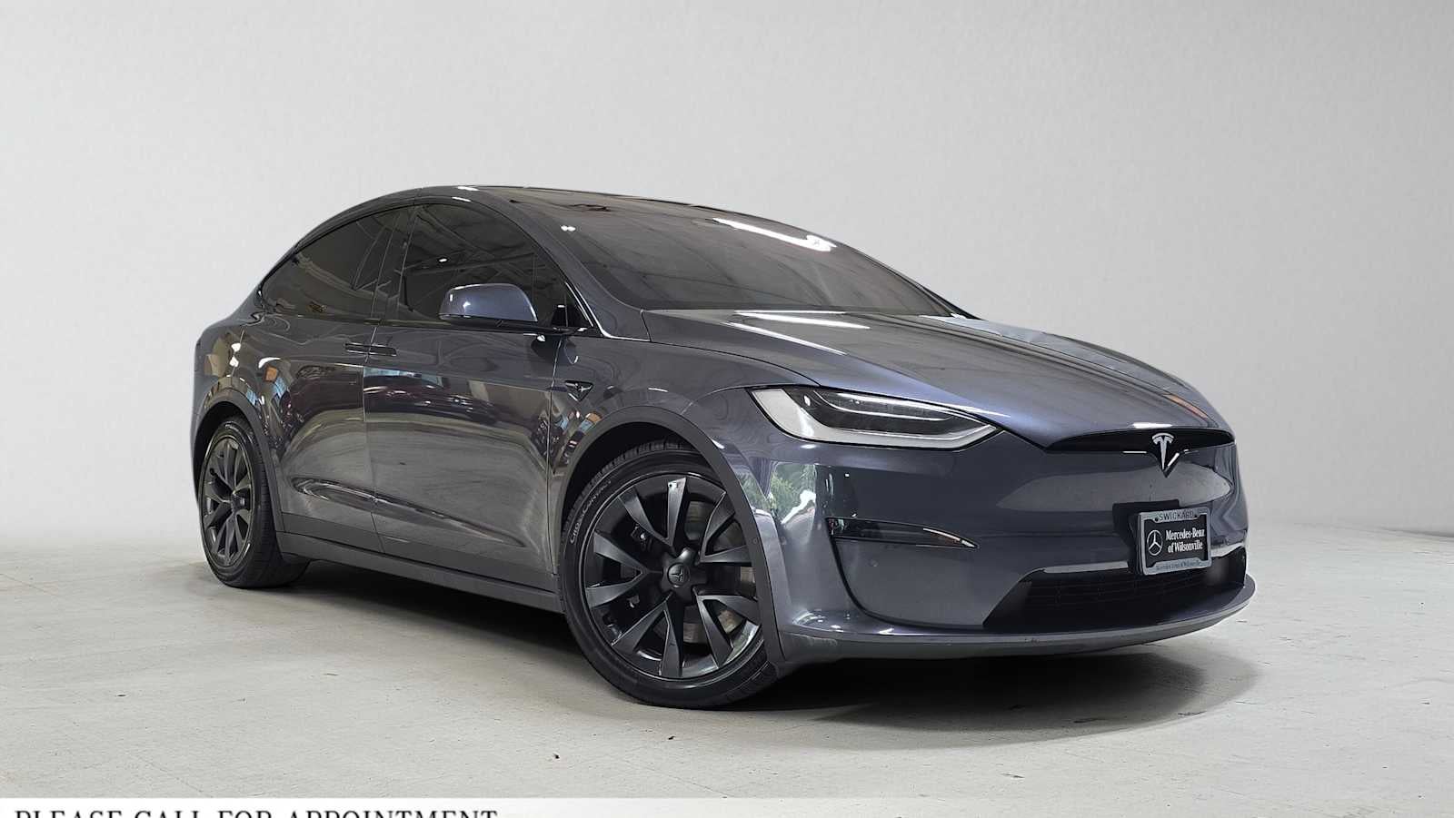 2022 Tesla Model X AWD in Solid Black — front three-quarter view