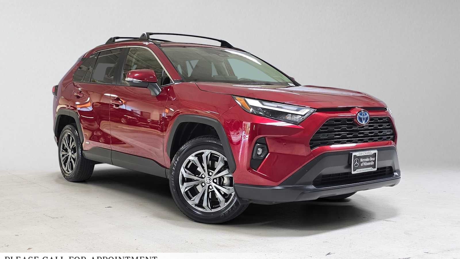 2024 Toyota RAV4 Hybrid XLE Premium in Ruby Flare Pearl — front three-quarter view