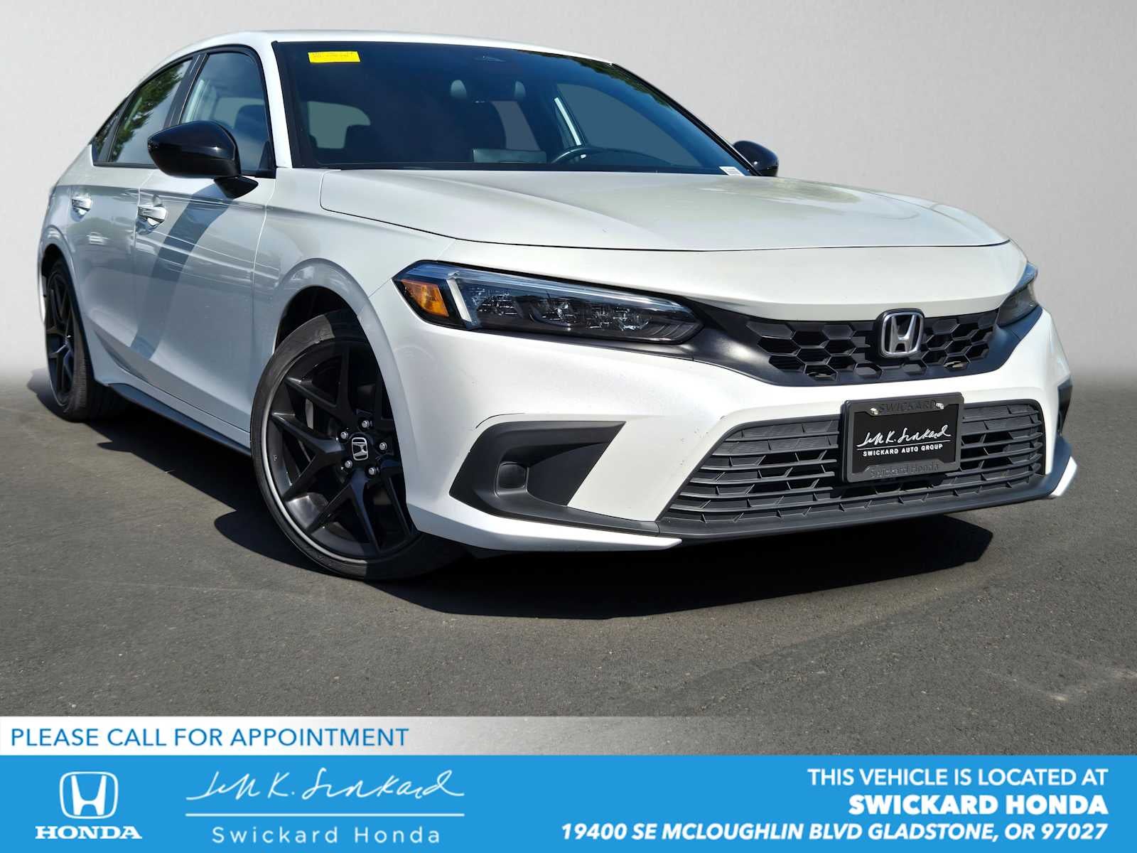 2023 Honda Civic Sport in Platinum White Pearl — front three-quarter view