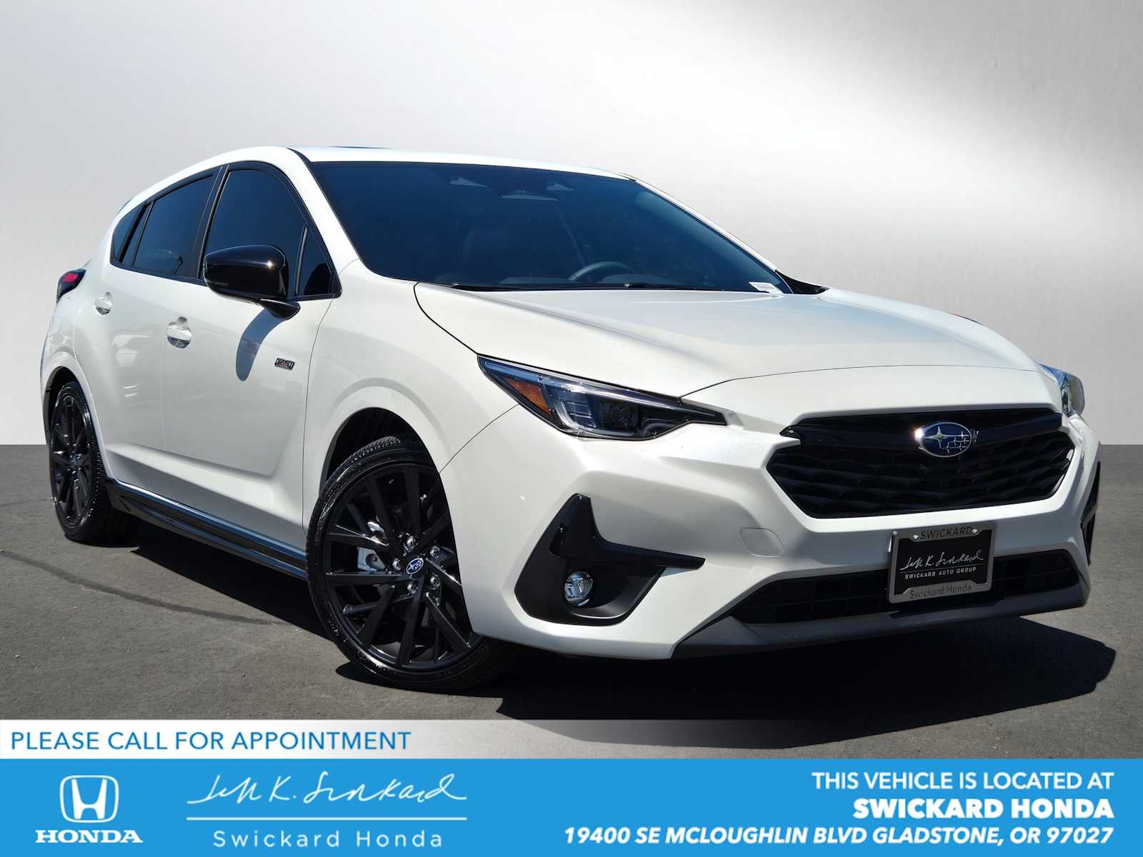 2025 Subaru Impreza RS in Crystal White Pearl — front three-quarter view