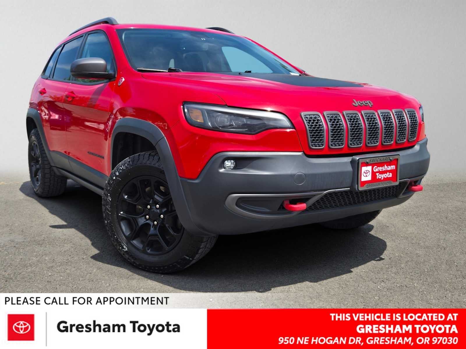 2019 Jeep Cherokee Trailhawk in Firecracker Red Clearcoat — front three-quarter view