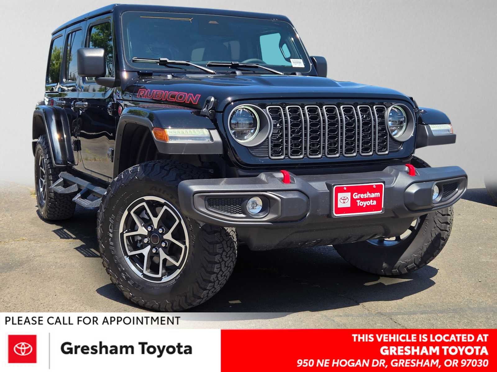 2026 Jeep Wrangler Rubicon in Black Clearcoat — front three-quarter view