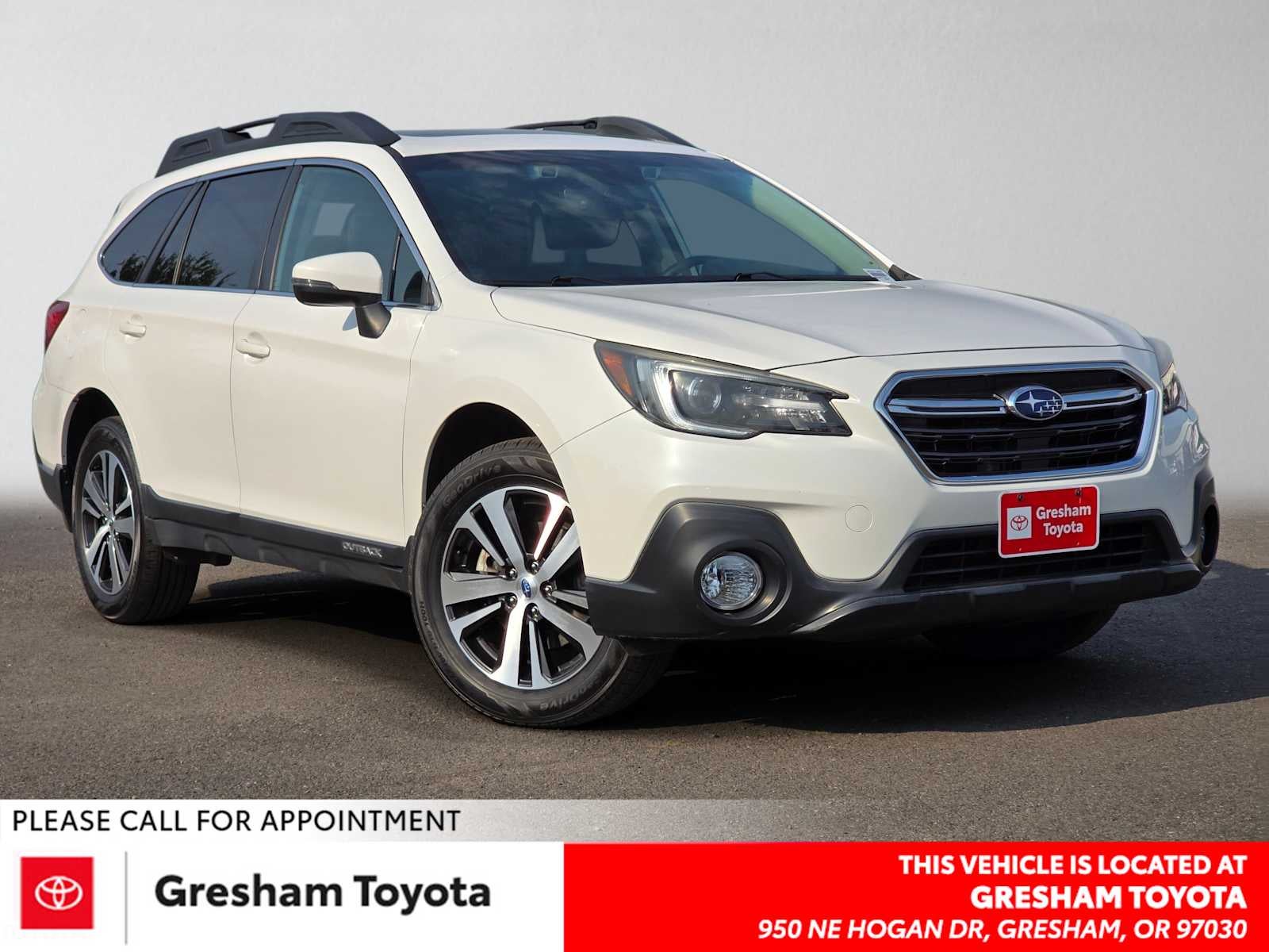 2019 Subaru Outback Limited in Crystal White Pearl — front three-quarter view
