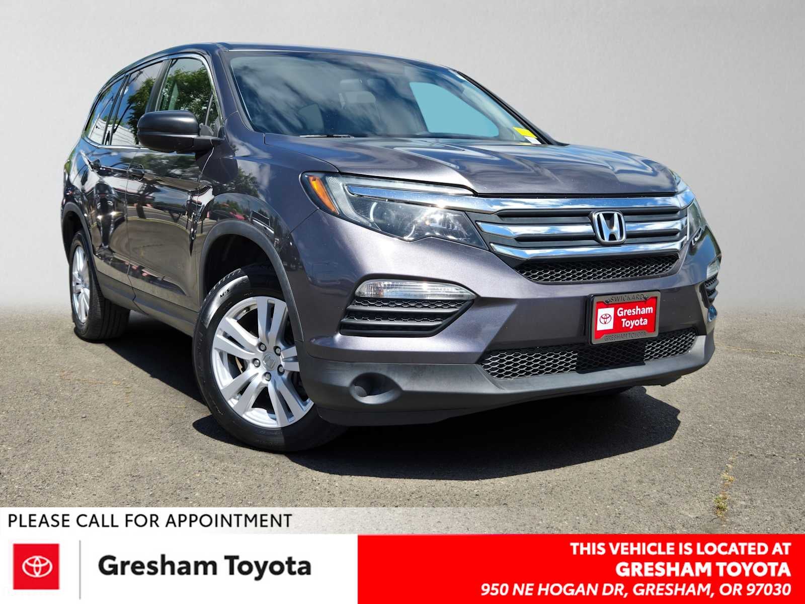 2018 Honda Pilot LX in Crystal Black Pearl — front three-quarter view