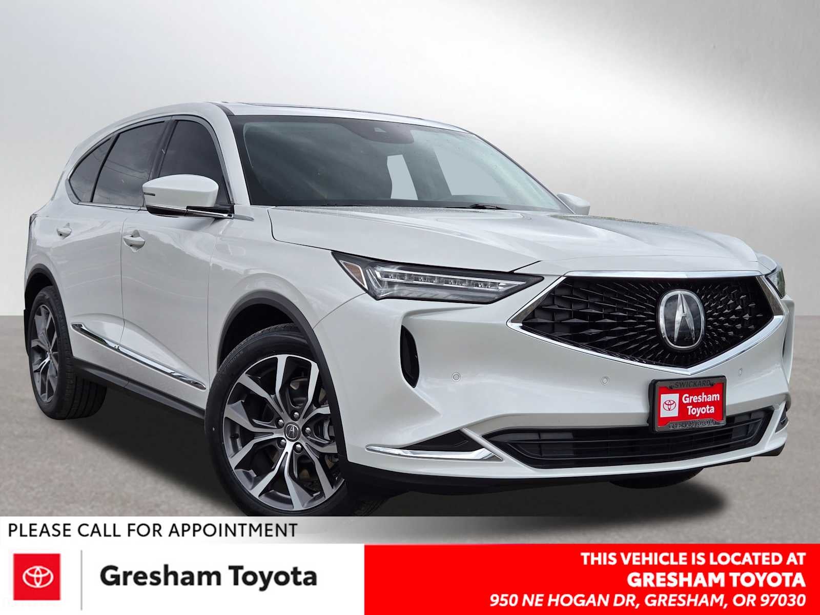 2023 Acura MDX w/Technology Package in Platinum White Pearl — front three-quarter view